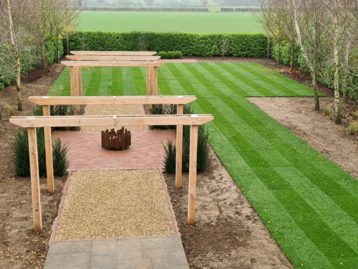 Oak pergolas & fresh-laid lawn